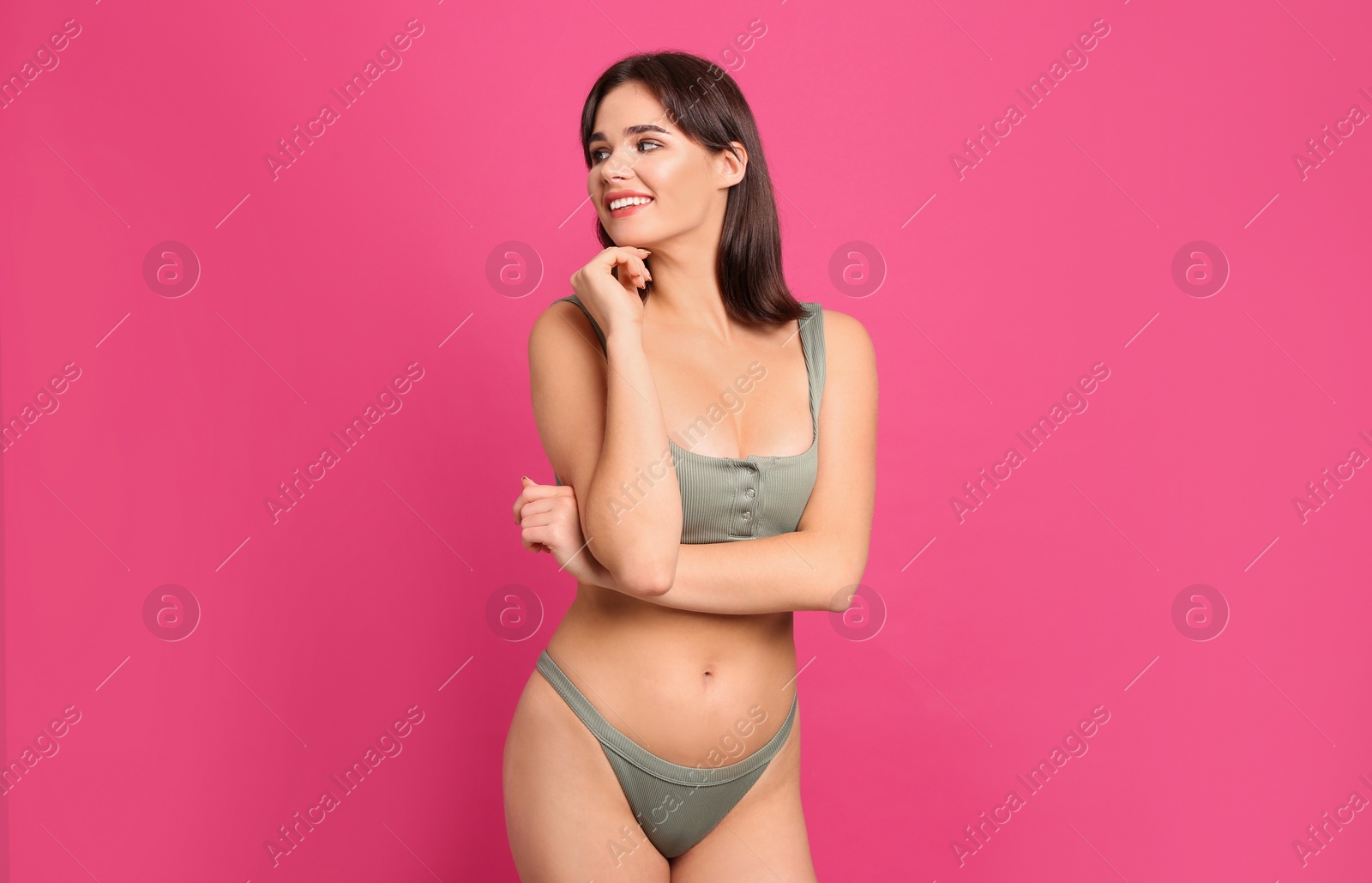 Photo of Beautiful woman in stylish bikini on pink background