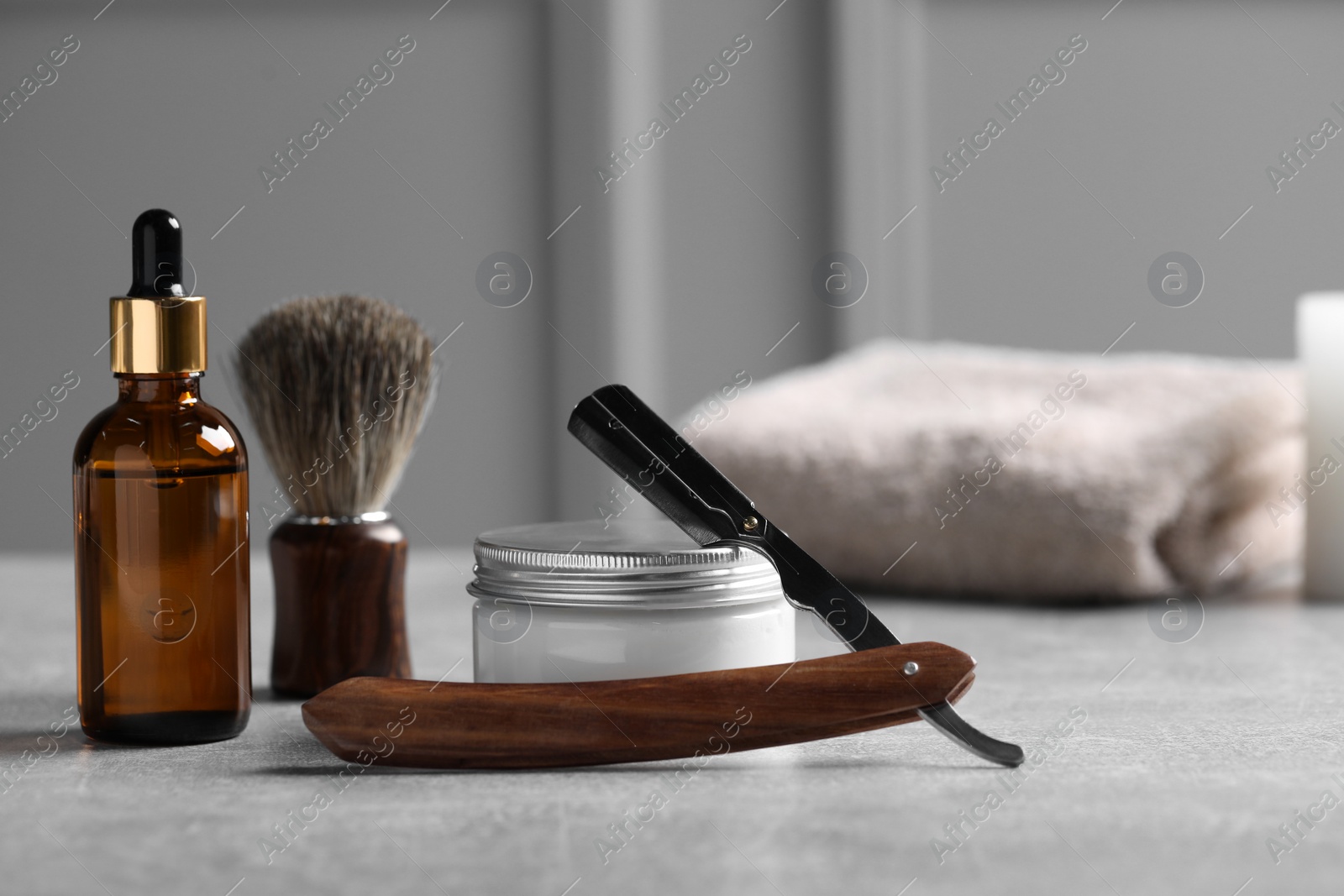 Photo of Set of men's shaving tools on grey table