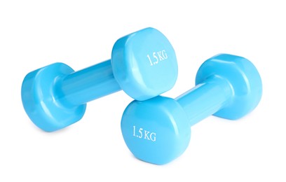 Light blue dumbbells isolated on white. Sports equipment