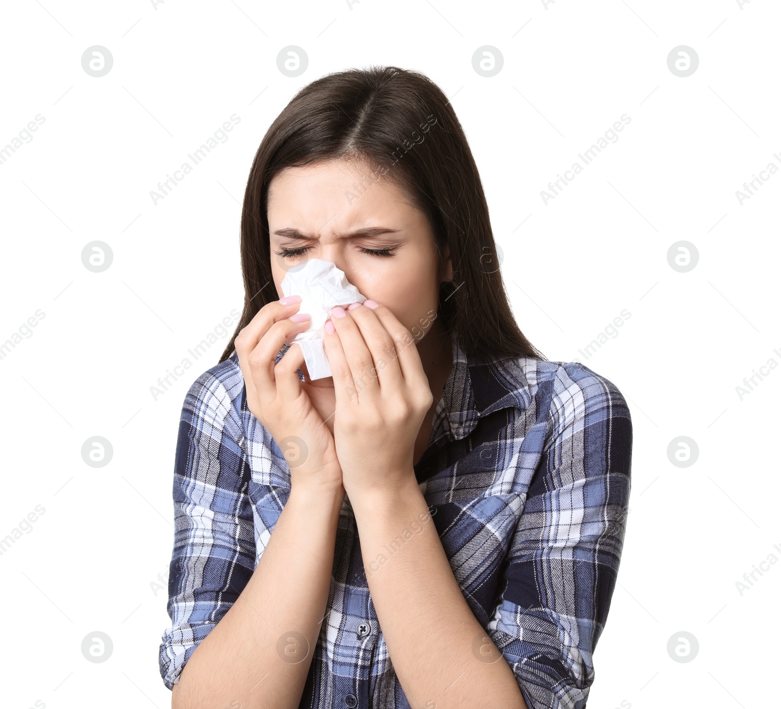 Photo of Young woman with tissue suffering from cold on white background