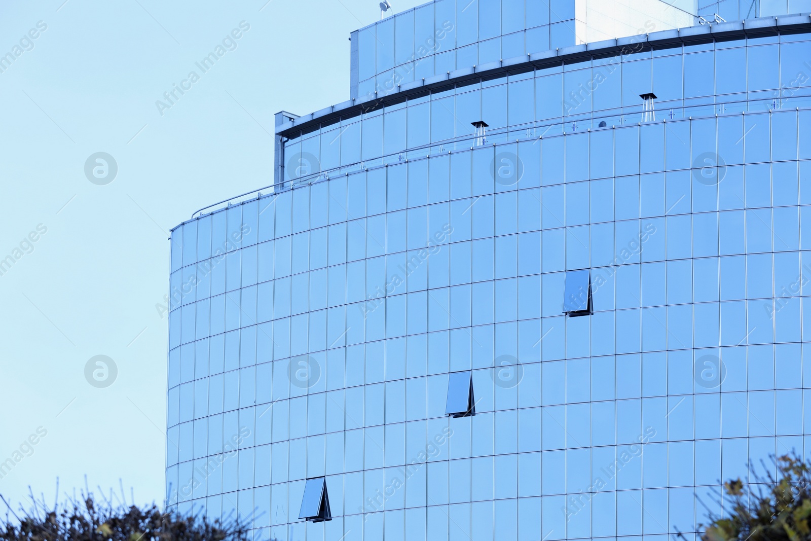 Photo of Office building with tinted windows. Modern architectural design