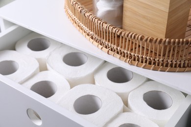Photo of Many toilet paper rolls in white drawer indoors