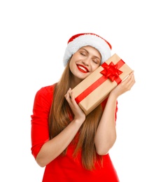 Photo of Young beautiful woman in Santa hat with gift box on white background. Christmas celebration