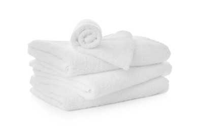 Stack of fresh clean towels on white background