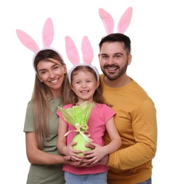 Photo of Easter celebration. Happy family with bunny ears and wrapped egg isolated on white