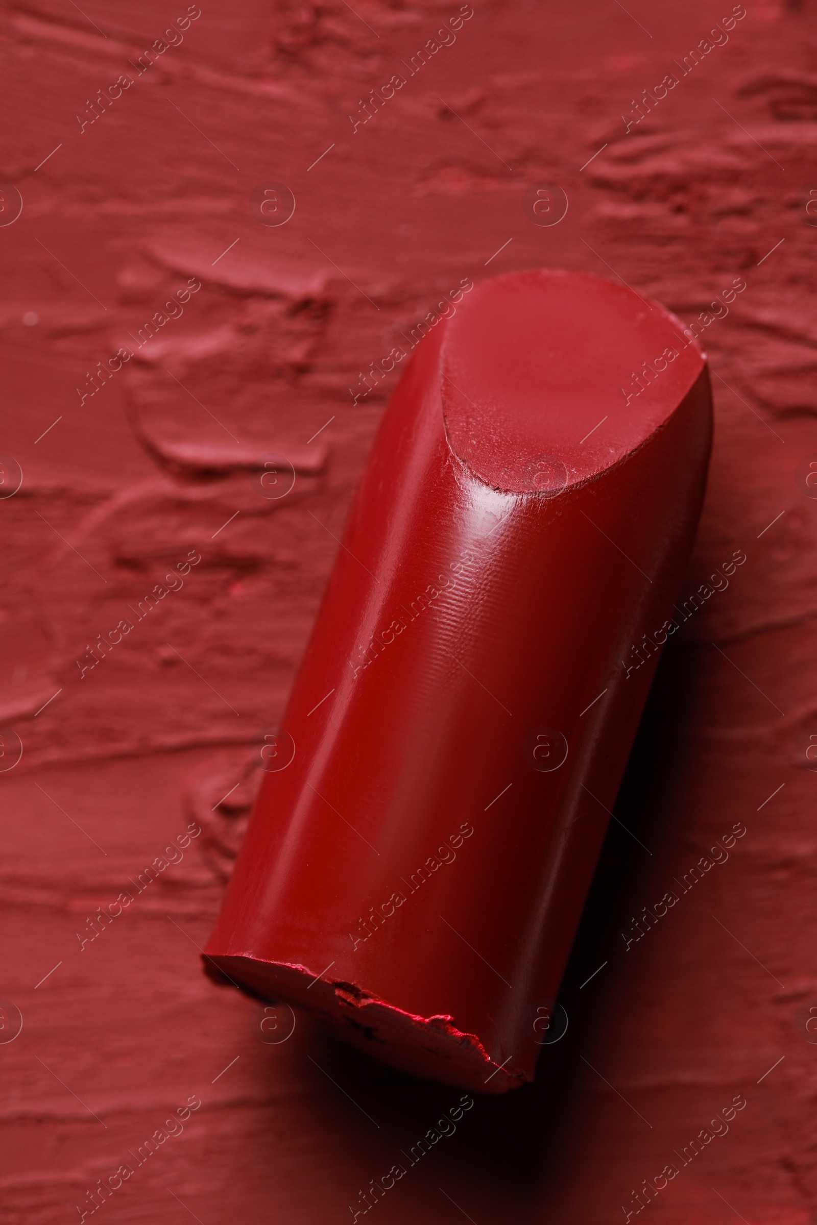 Photo of Beautiful red lipstick and smears, top view