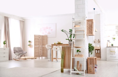 Modern eco style interior with wooden crates and shelves