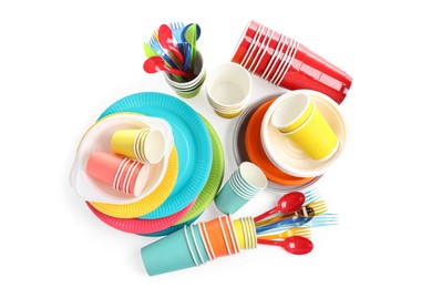 Photo of Set with different disposable tableware on white background, top view