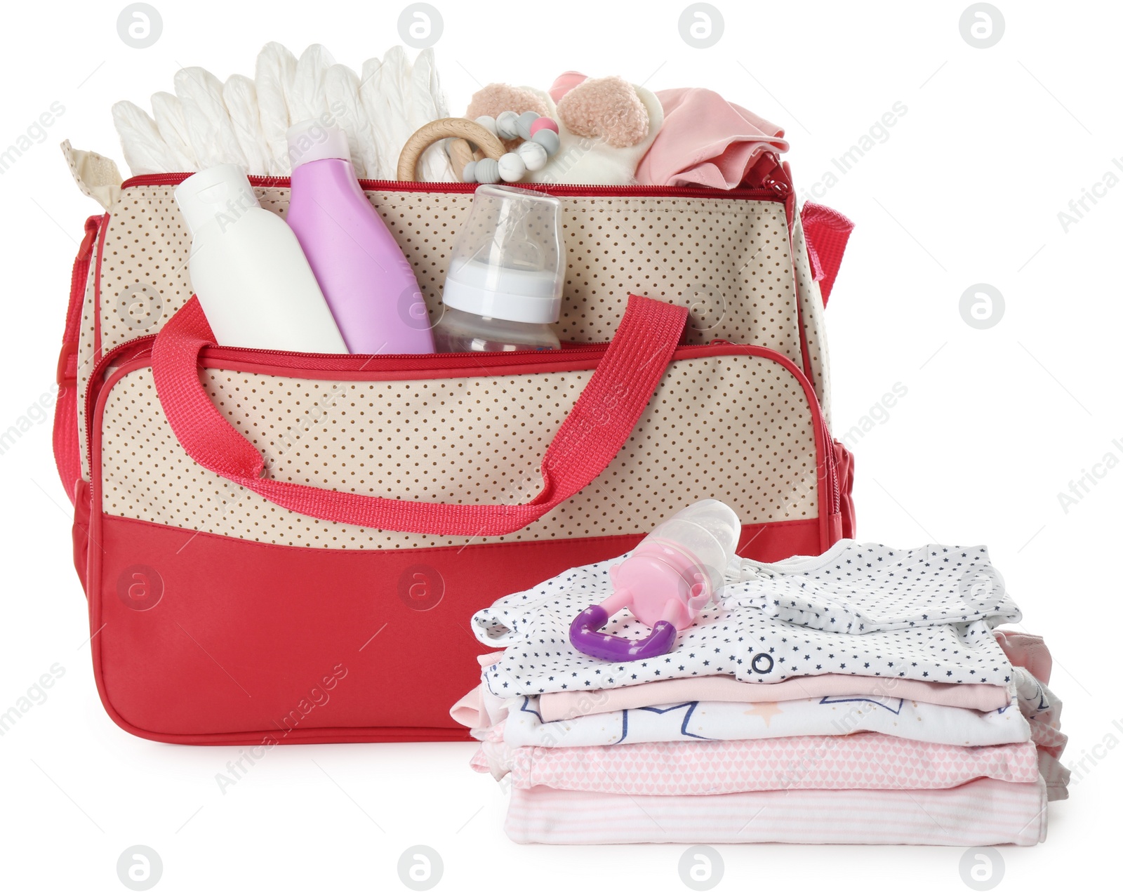 Photo of Mother's bag with baby's stuff isolated on white