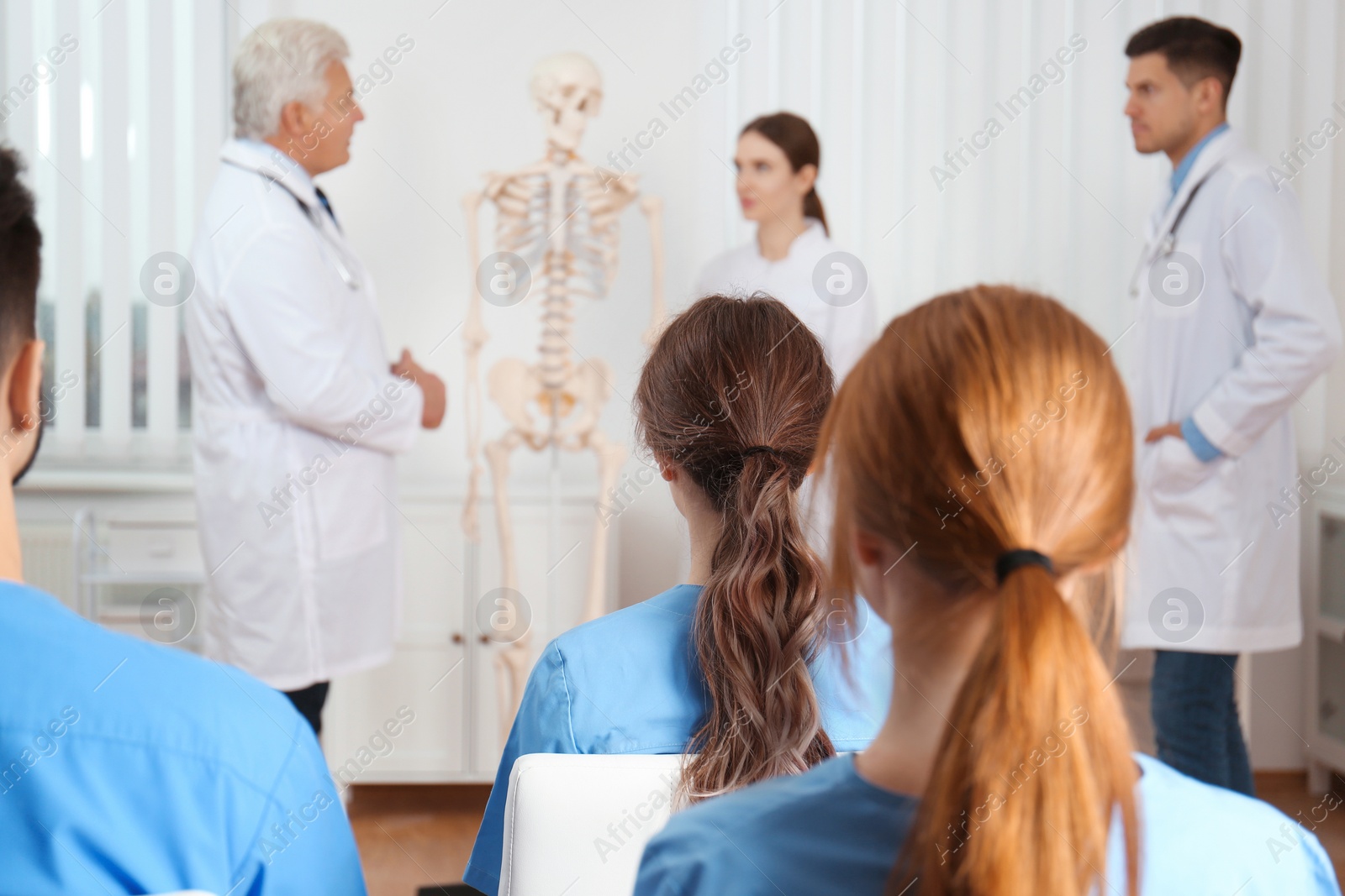 Photo of Medical students having lecture in orthopedics at clinic