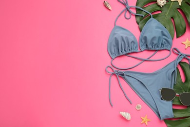 Photo of Flat lay composition with stylish bikini on pink background. Space for text