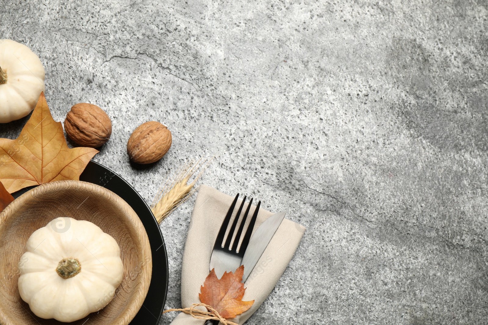 Photo of Festive table setting on grey background, flat lay with space for text. Thanksgiving Day celebration