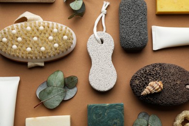 Flat lay composition with pumice stones on brown background