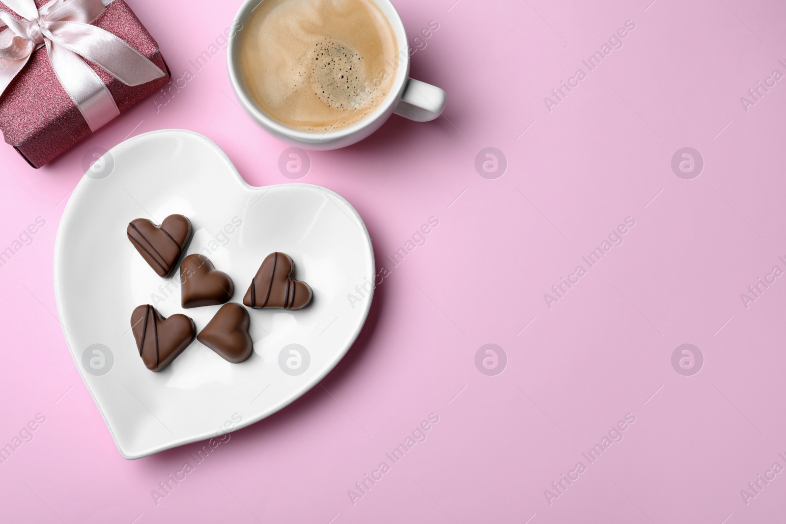 Photo of Romantic breakfast on pink background, flat lay with space for text. Valentine's day celebration