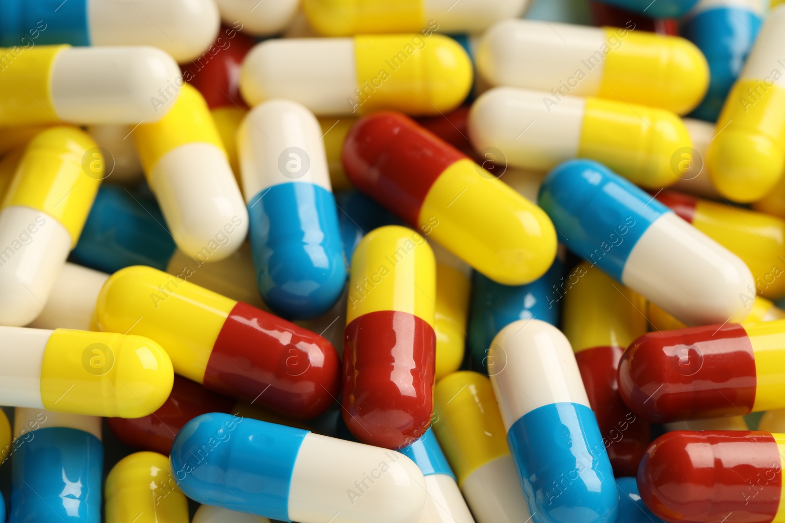 Photo of Many antibiotic pills as background, closeup. Medicinal treatment