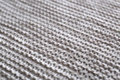 Photo of Beautiful grey knitted fabric as background, closeup