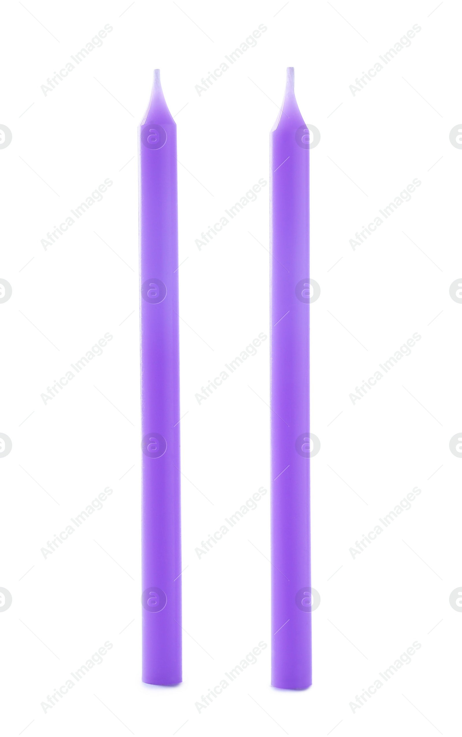 Photo of Thin purple birthday candles isolated on white