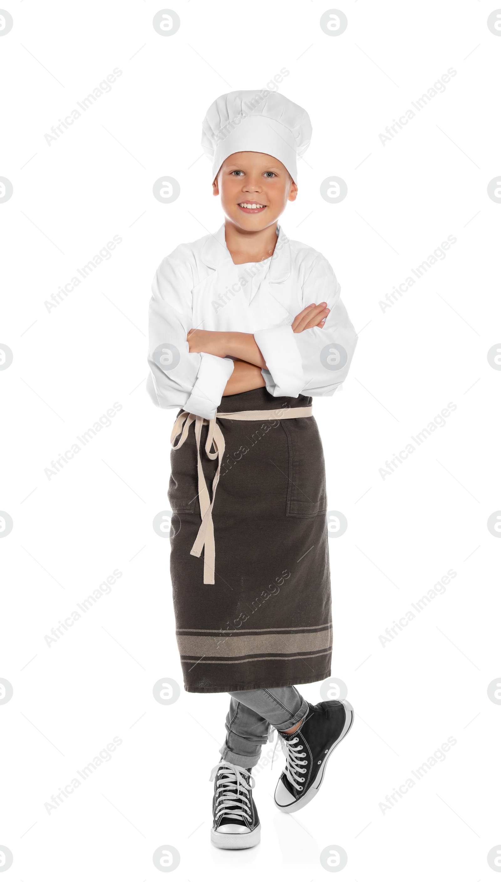 Photo of Full length portrait of little boy in chef hat on white background