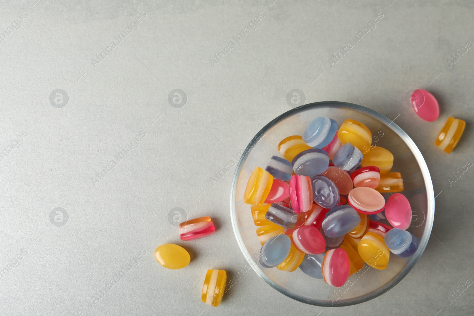 Photo of Tasty sweets on light grey table, flat lay. Space for text