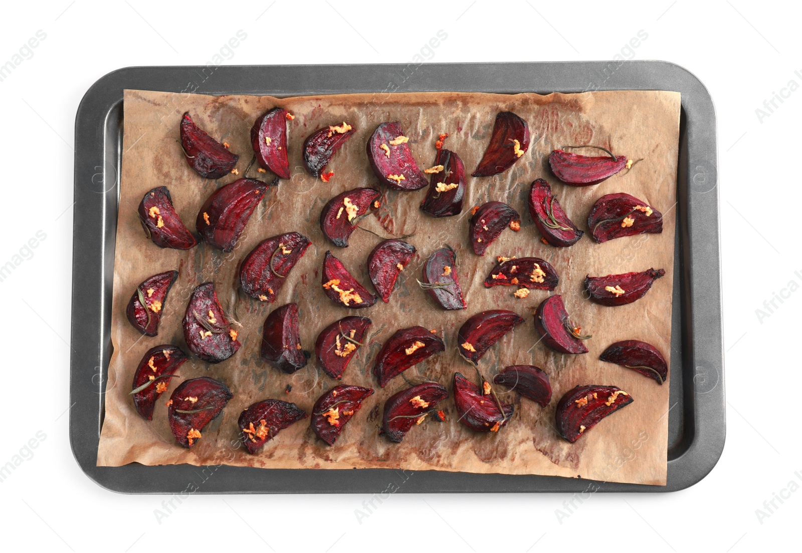 Photo of Baking tray with roasted beetroot slices on white background, top view