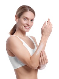 Photo of Woman applying body cream onto her arm against white background