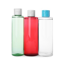 Bottles of micellar cleansing water on white background