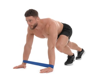 Young man exercising with elastic resistance band on white background