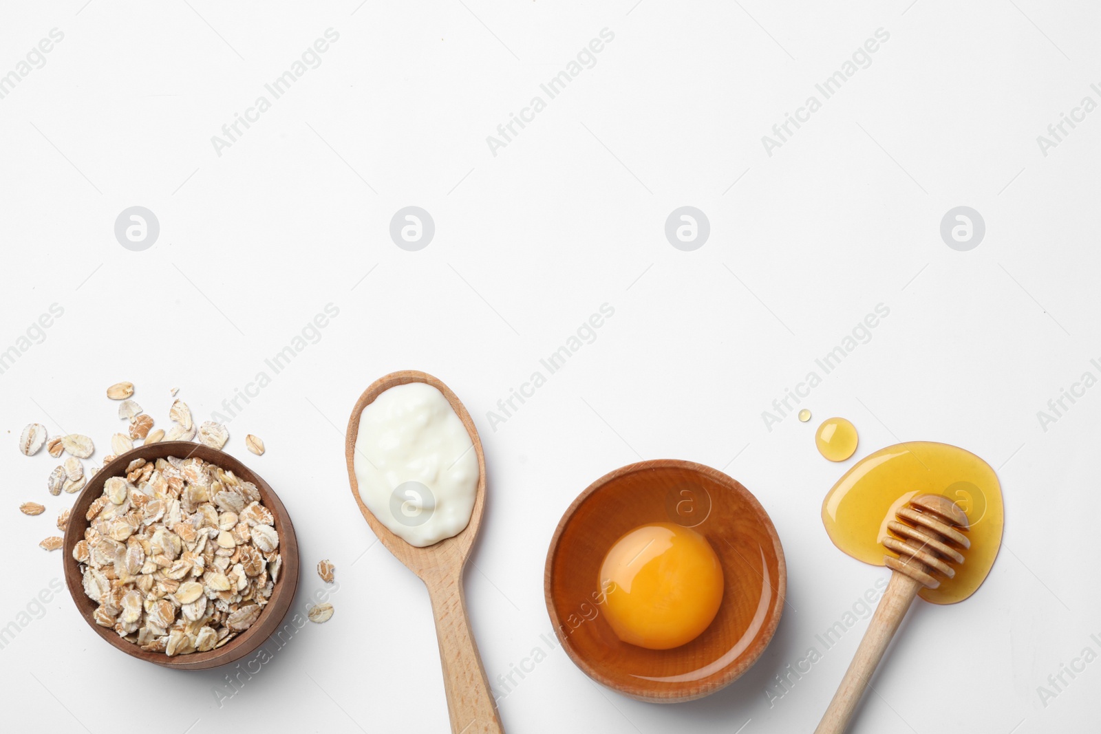 Photo of Composition of ingredients for handmade face mask on white background, top view