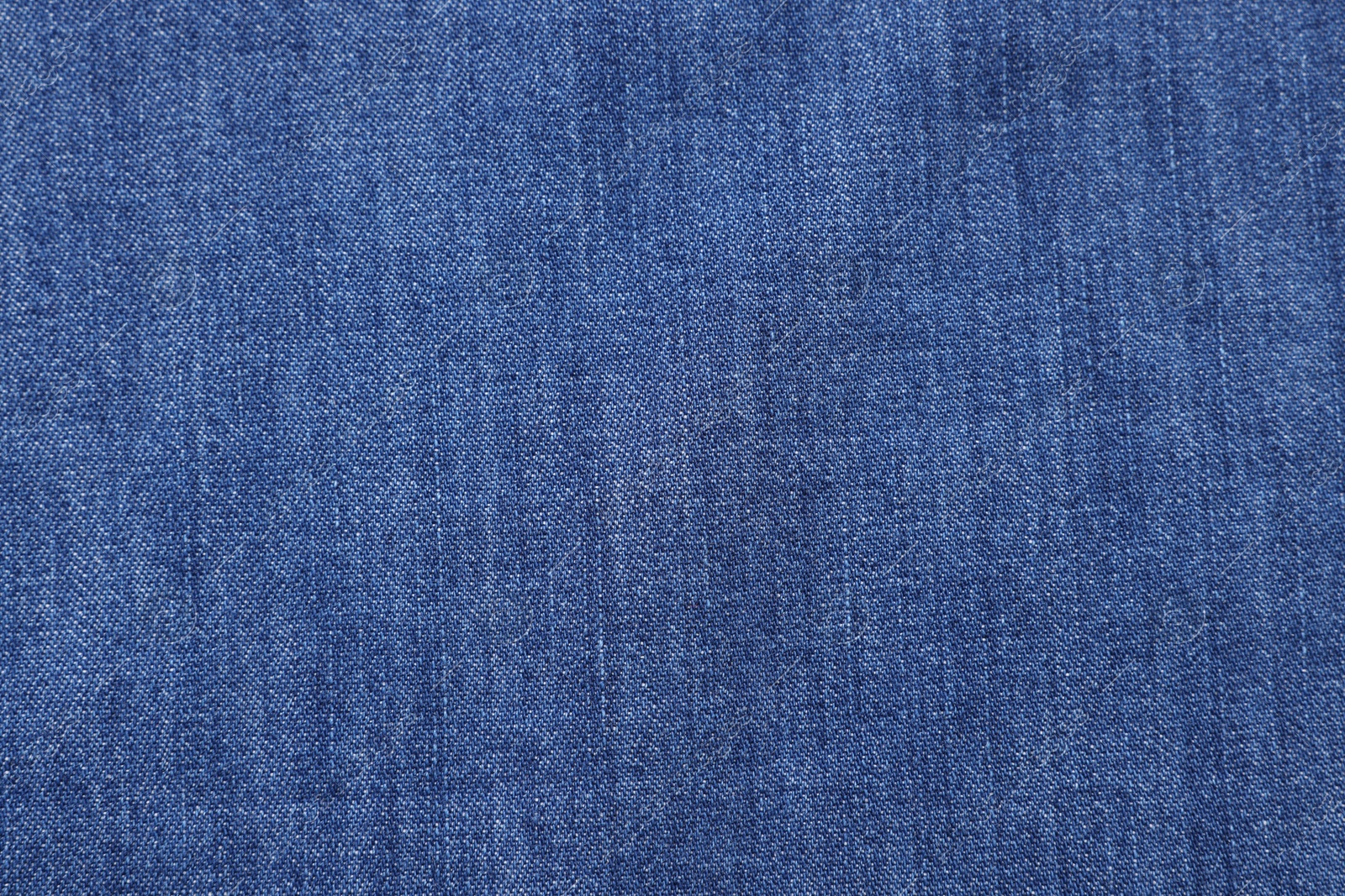 Photo of Texture of blue fabric as background, top view