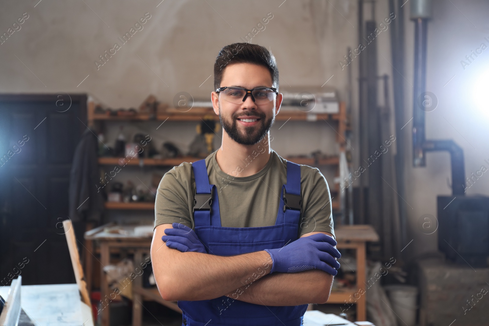 Photo of Portrait of professional male carpenter in workshop