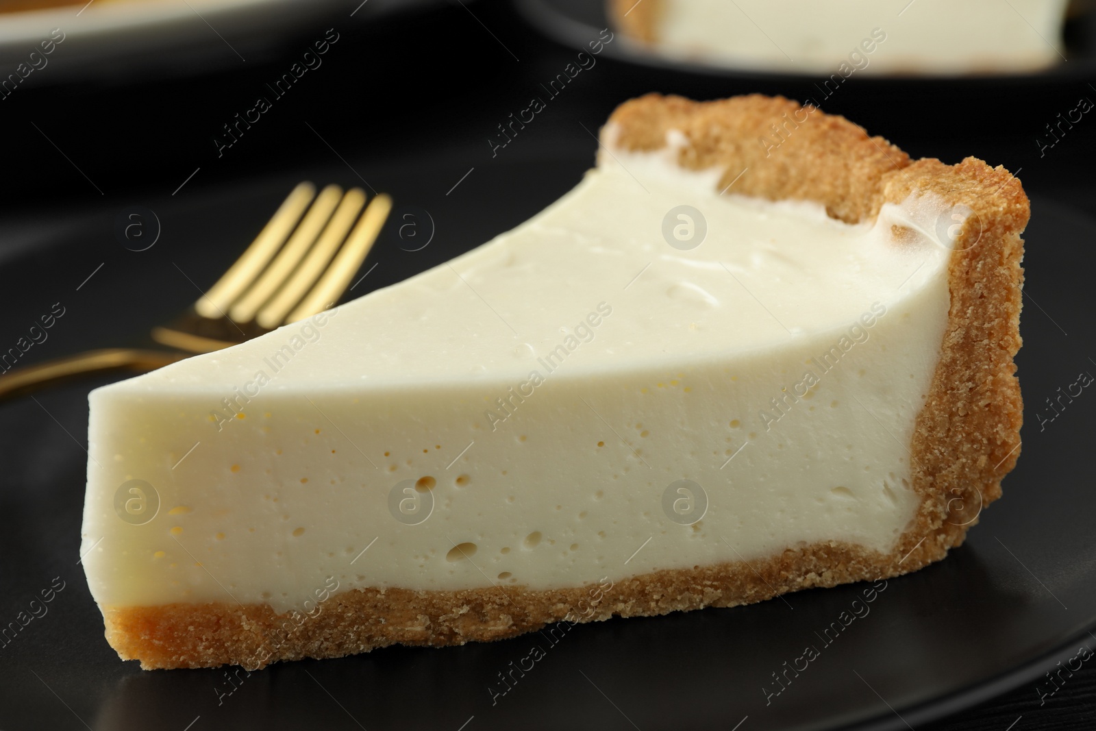 Photo of Piece of tasty vegan tofu cheesecake on plate, closeup
