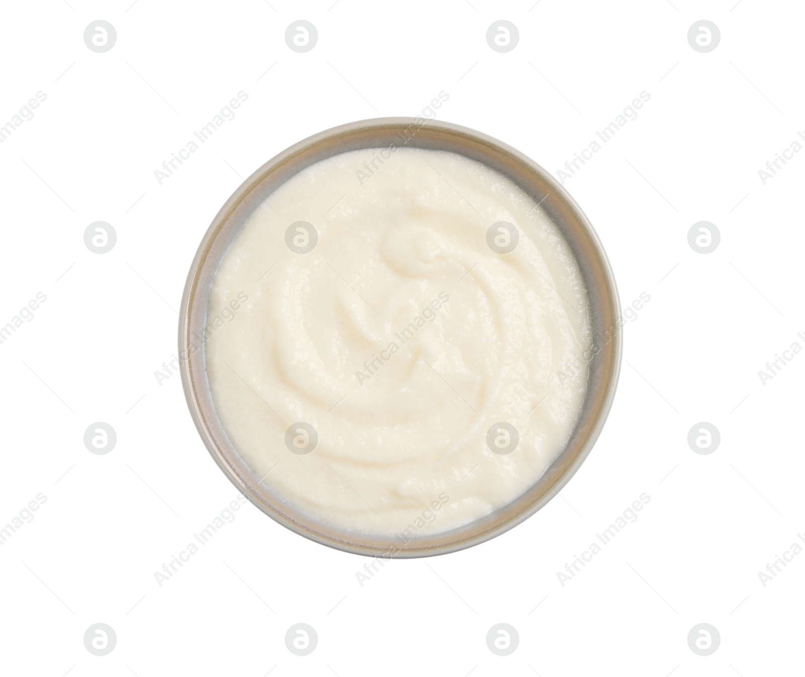 Photo of Bowl with delicious semolina pudding isolated on white, top view