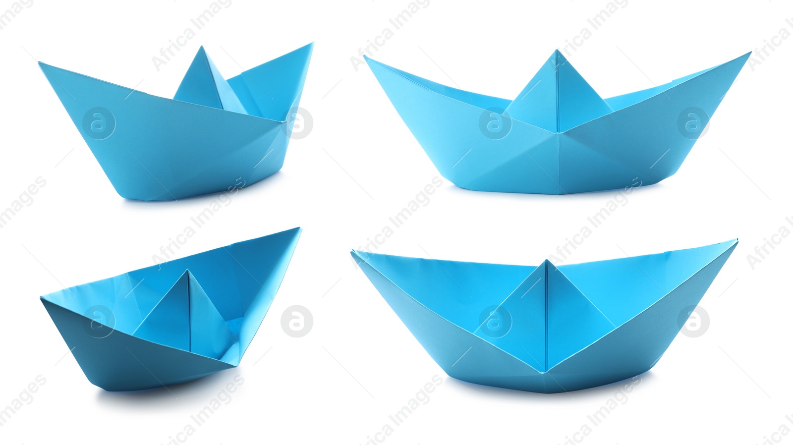 Image of Set with light  blue paper boats on white background