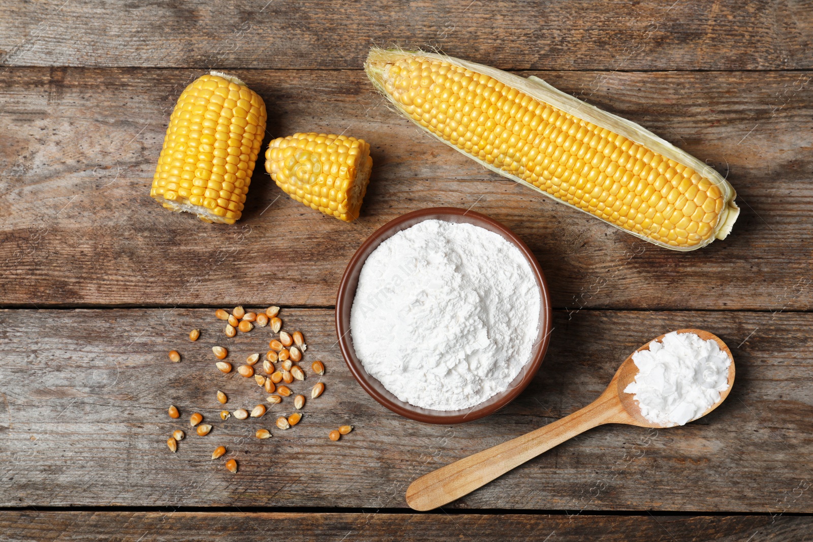 Photo of Flat lay composition with corn starch on wooden background