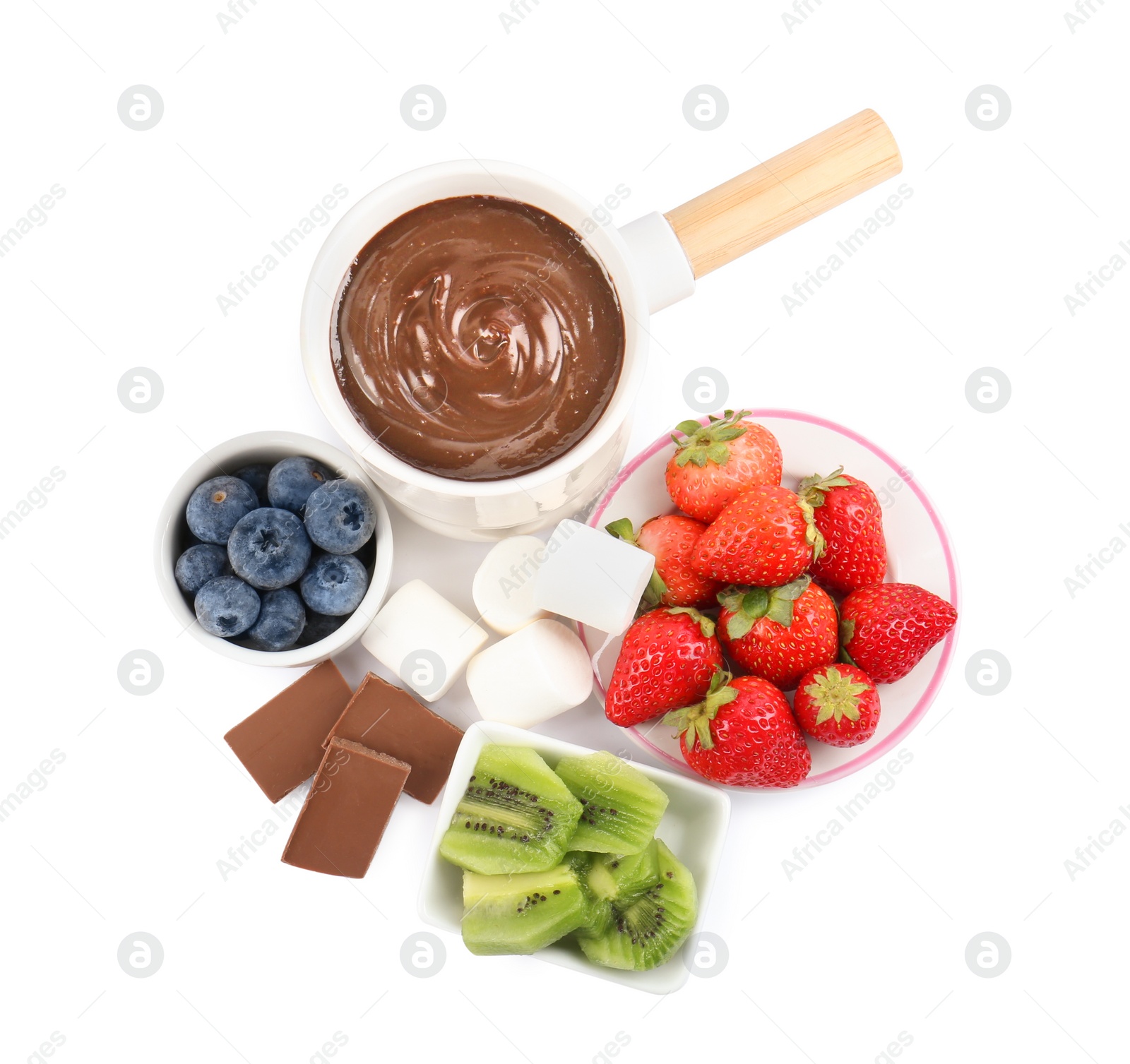 Photo of Fondue pot with melted chocolate, fresh berries, kiwi and marshmallows isolated on white, top view