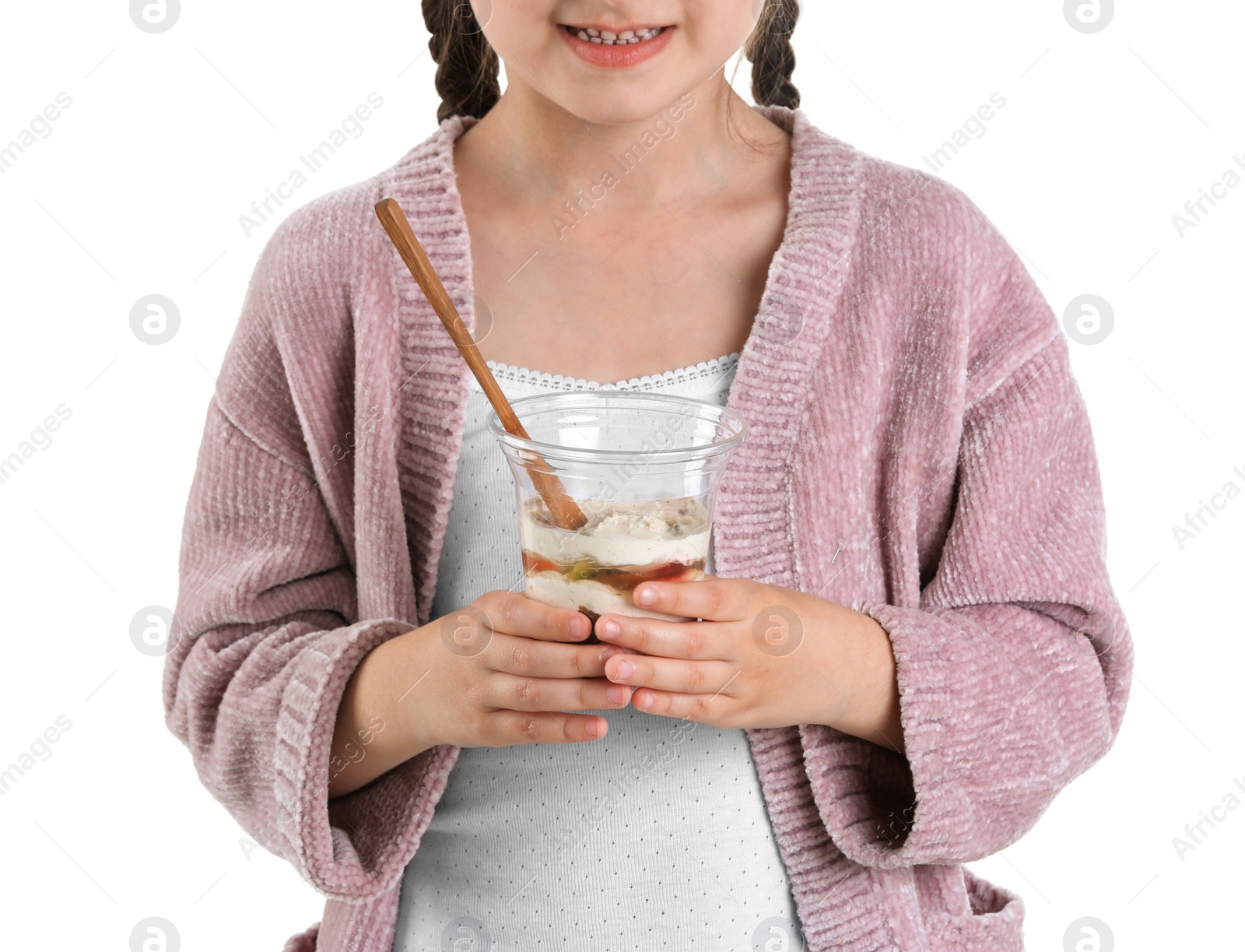 Photo of Little girl with yogurt on white background, closeup