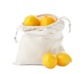 Photo of Cotton eco bag with lemons isolated on white