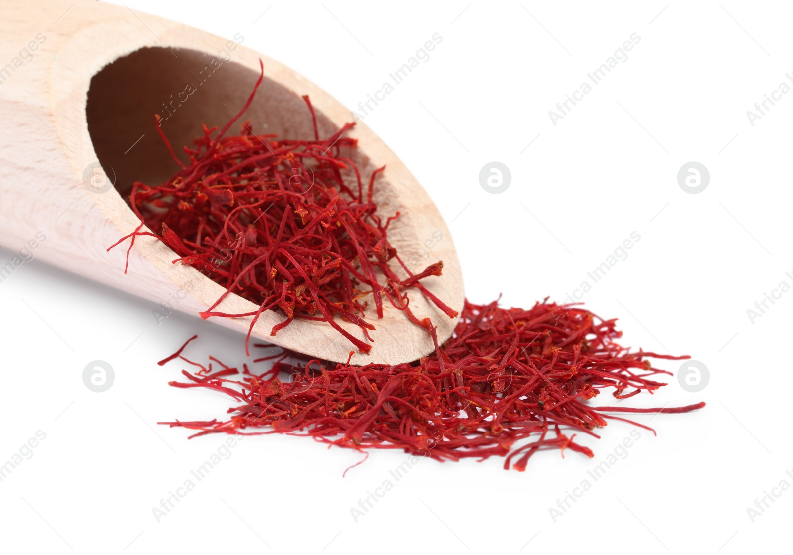 Photo of Aromatic saffron and scoop isolated on white