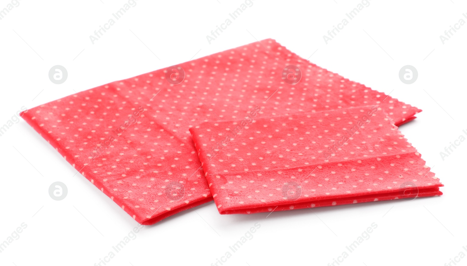 Photo of Red reusable beeswax food wraps on white background