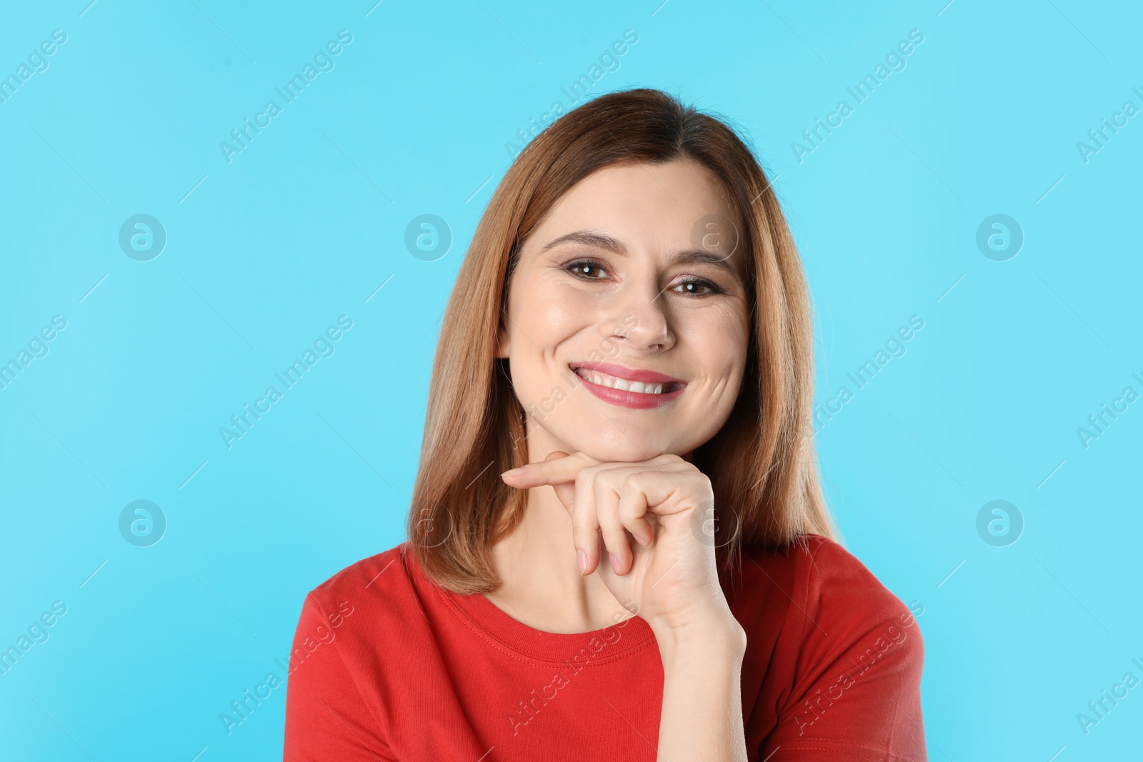 Photo of Smiling woman with perfect teeth on color background