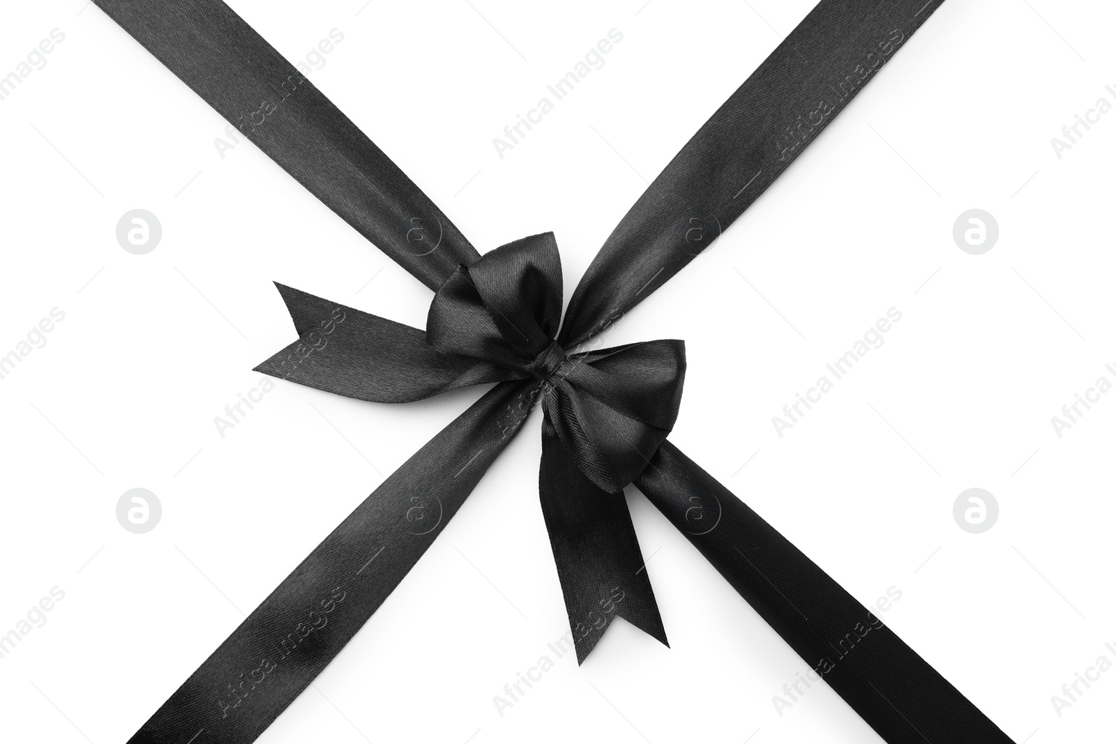 Photo of Black satin ribbon with bow isolated on white, top view