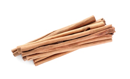 Aromatic cinnamon sticks on white background, top view