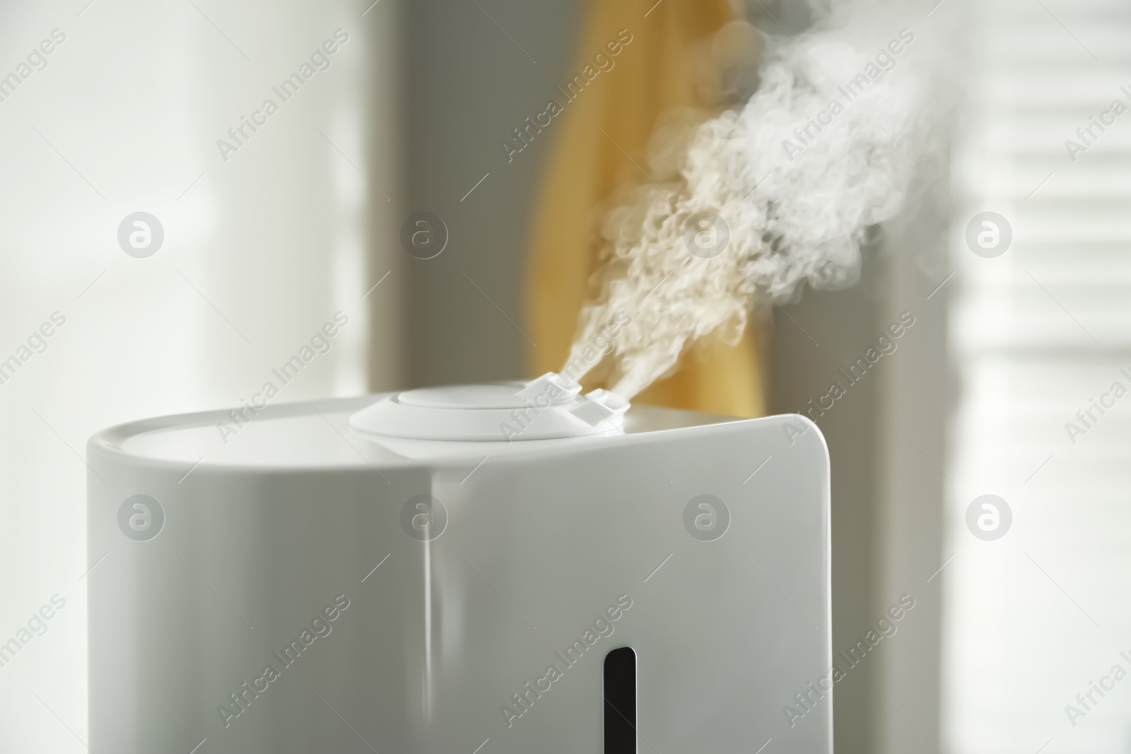 Photo of Modern air humidifier at home, closeup view