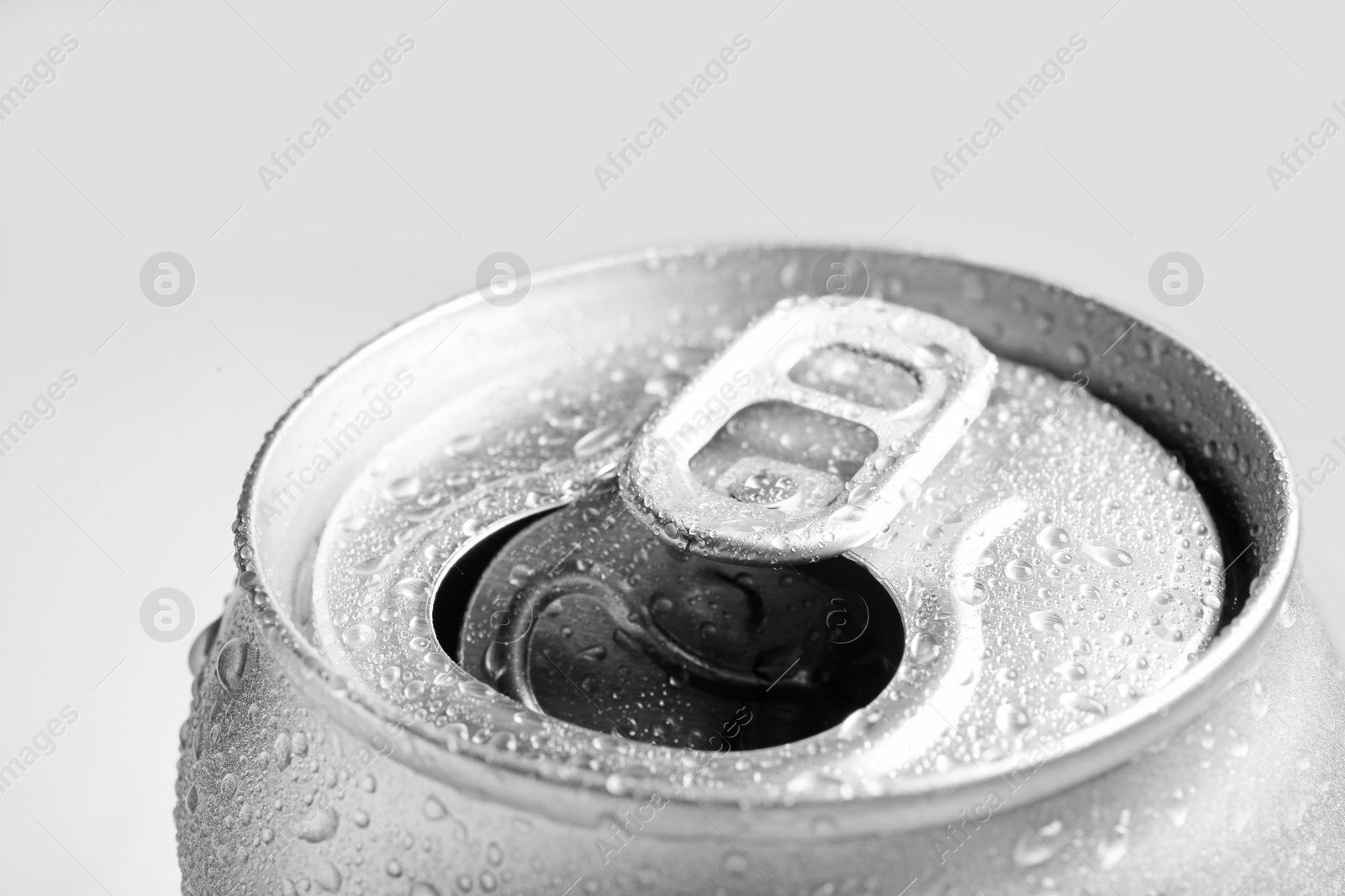 Photo of Wet open can on grey background, closeup