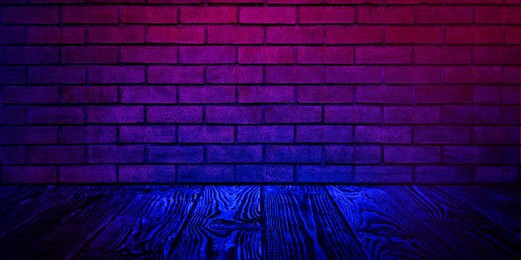 Image of Room with brick wall and wooden floor in neon lights, banner design