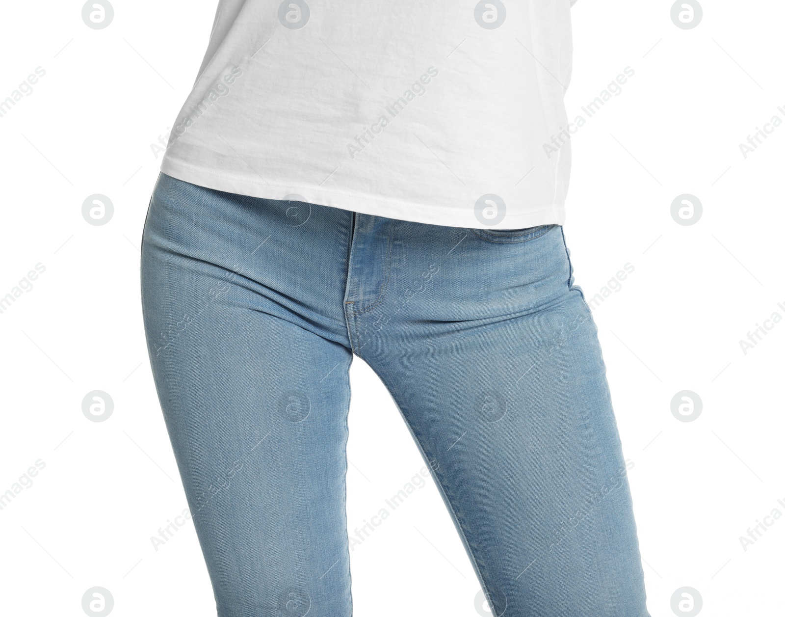 Photo of Woman wearing stylish light blue jeans on white background, closeup