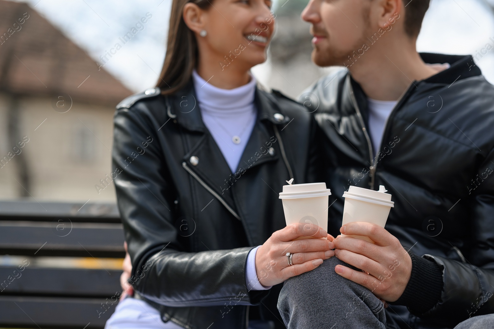 Photo of Lovely young couple spending time together outdoors, focus on hands. Romantic date