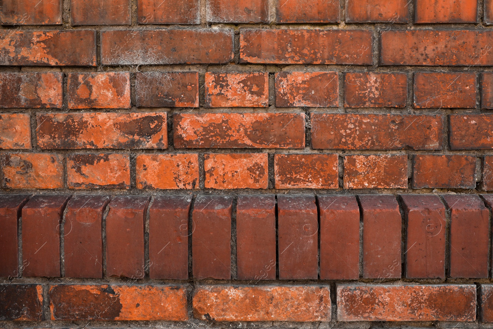 Photo of Texture of old red brick wall as background