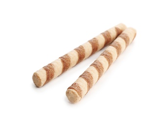 Photo of Delicious wafer rolls on white background. Sweet food