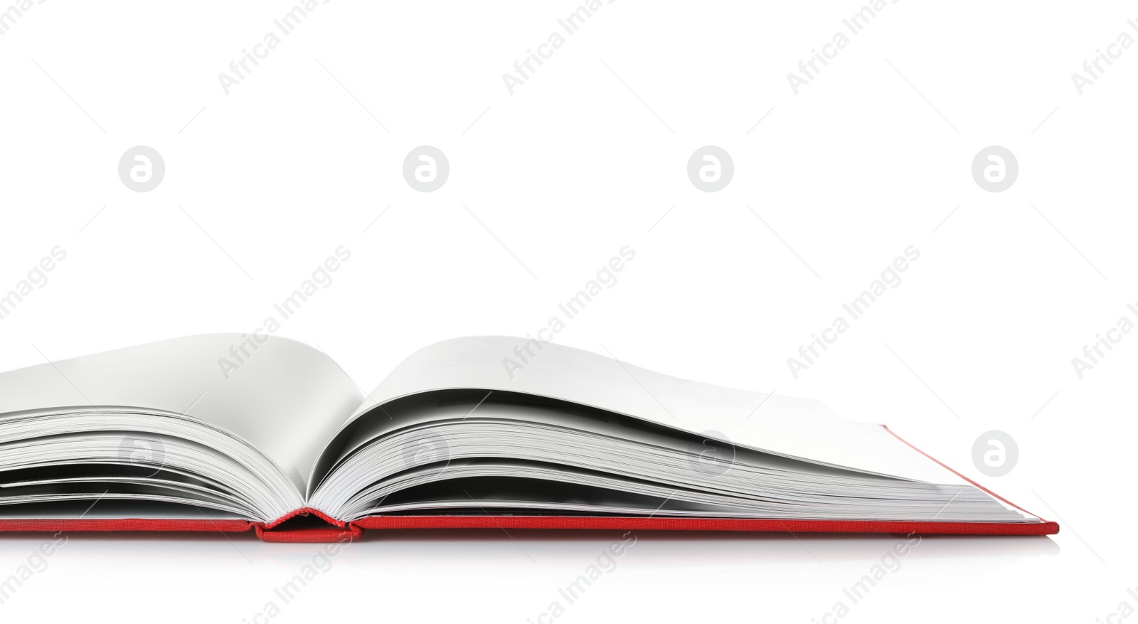 Photo of Open book with red cover on white background, closeup